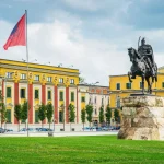 Skanderbeg Square in Tirana, Albania, featuring the statue of Skanderbeg and surrounding historic buildings