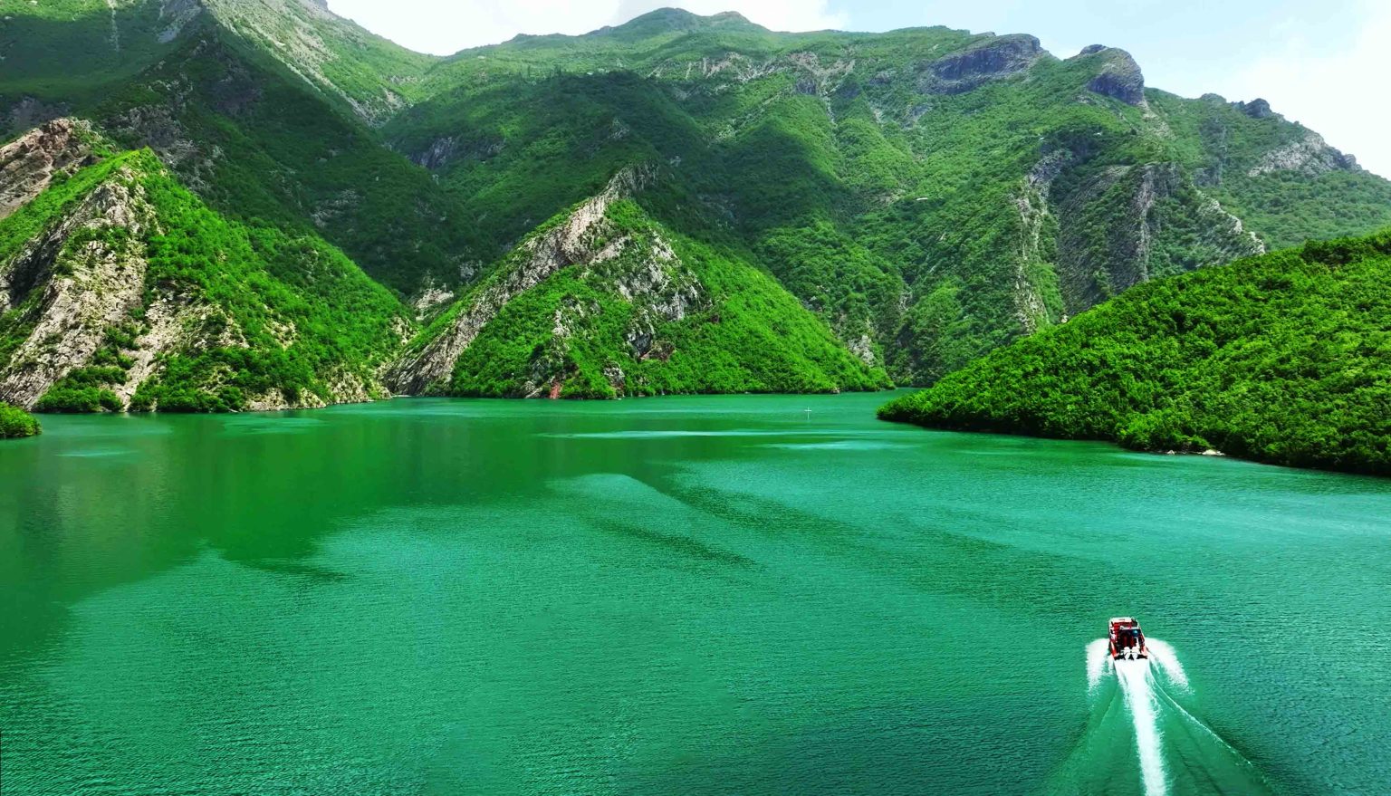 Beautiful green mountains and North Albania boat on Komani lake in North Albania