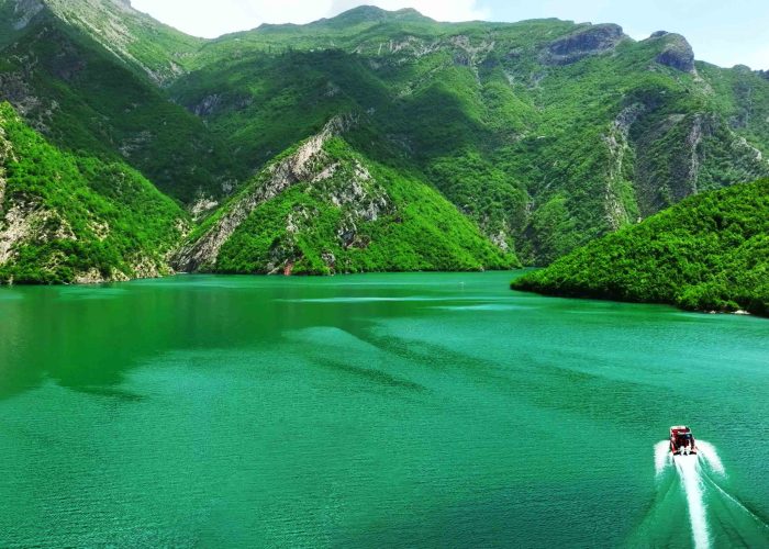 Beautiful green mountains and North Albania boat on Komani lake in North Albania