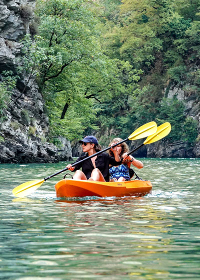 Two people canoeing on Shala River in North Albania