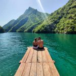 Couple enjoying the view of Koman Lake from the dock.