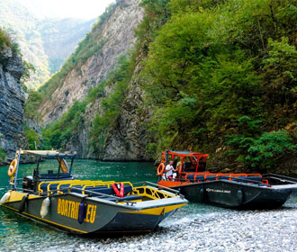 Two WaterMate LR9 Safari boats cruising on the scenic Koman Lake in North Albania