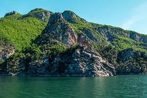 Rocky mountain cliffs and turquoise water on the Lezhe to Shala River daily boat tour in North Albania