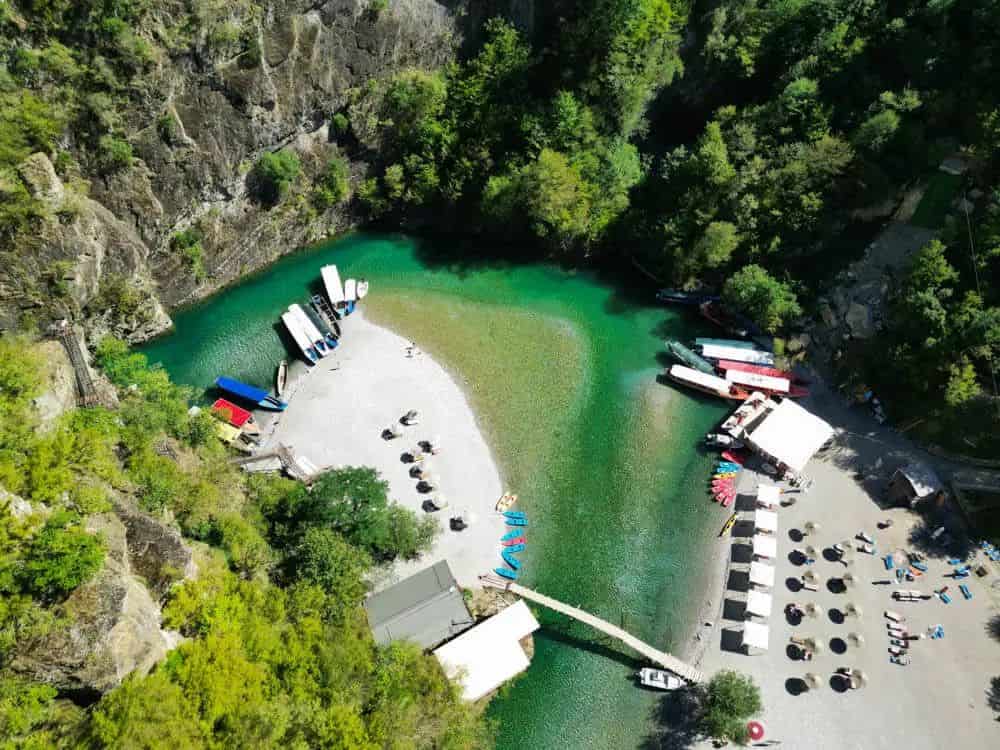 Aerial view of boats docked at the Shala River arrival cove, Albania