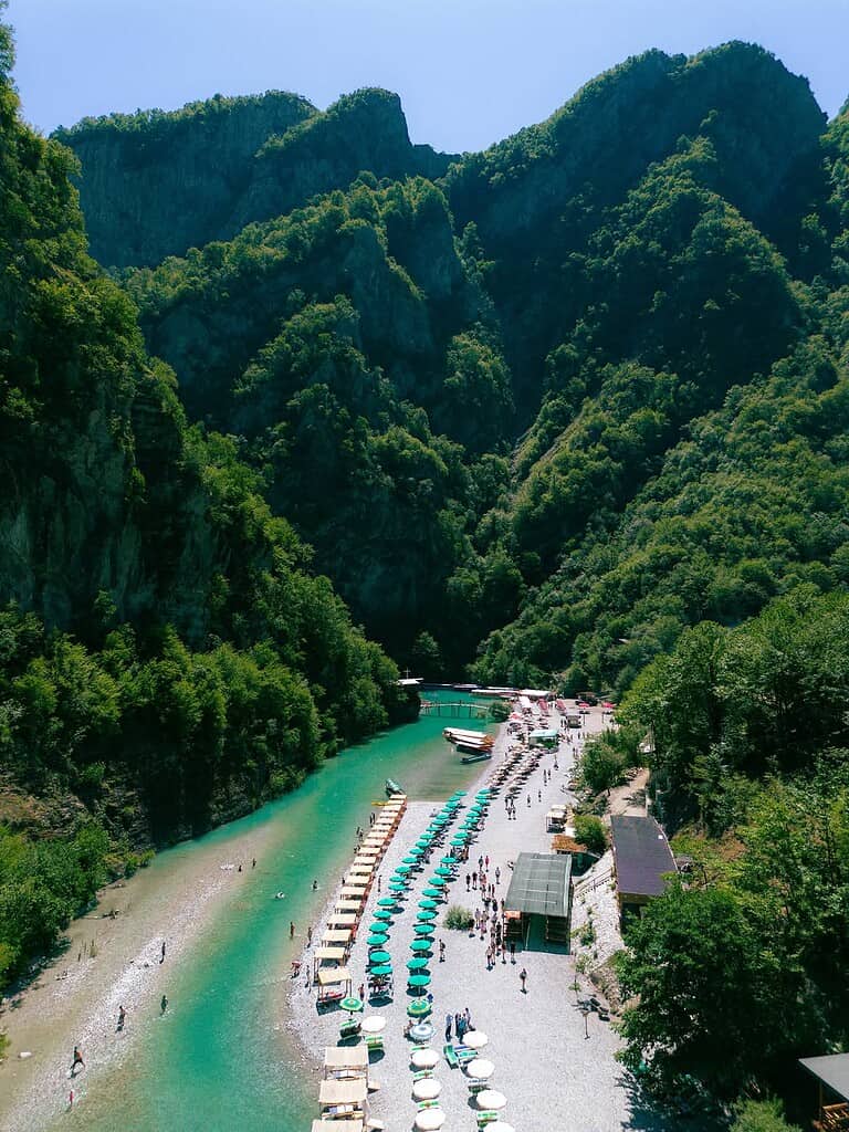Shala River beach surrounded by steep green mountains in northern Albania