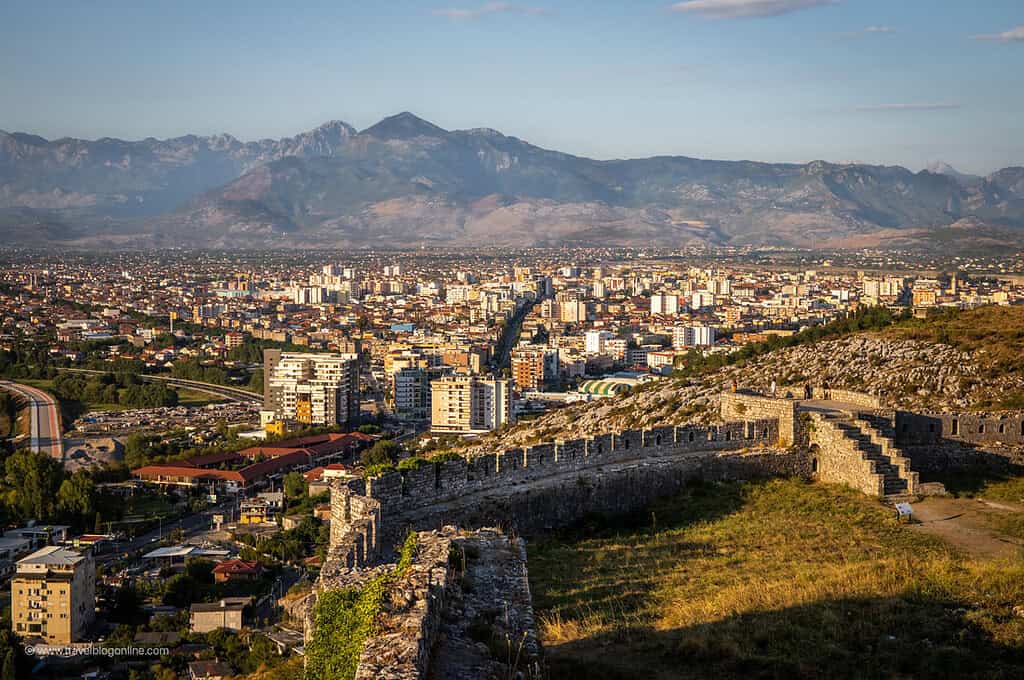 Stone walls of Rozafa Castle with the city of Shkoder and mountains stretching out below