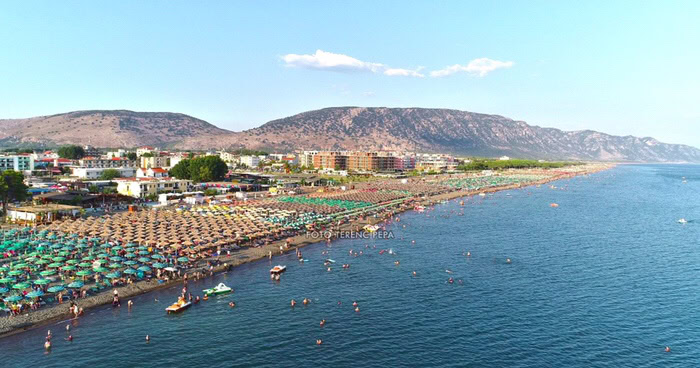 Aerial view of Velipoja beach with rows of umbrellas along the Adriatic coast in northern Albania
